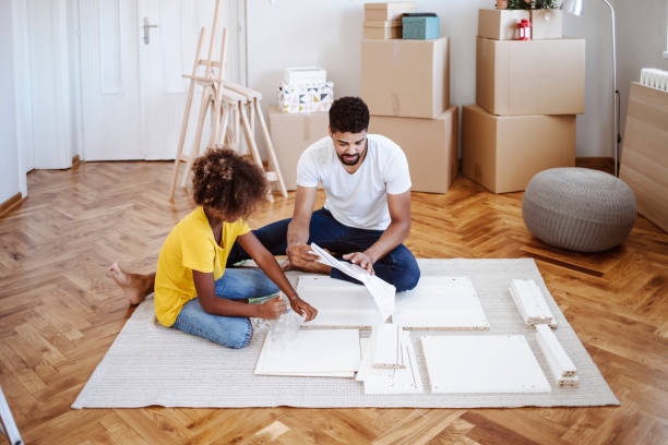 istock Unpacking Boxes and Assembling Furniture 1336256571