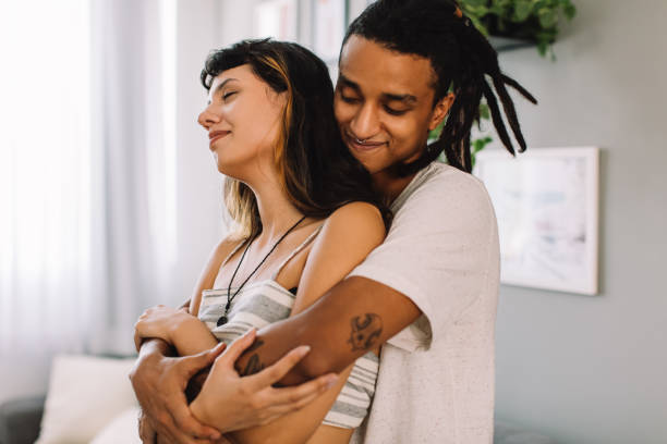 istock Loving young couple bonding indoors 1336259713