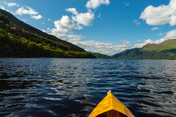 kayaking on loch lomond in scotland while on vacation - loch rowboat lake landscape imagens e fotografias de stock