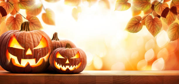 istock Three halloween pumpkin lanterns with a scary evil faces. 1336261965