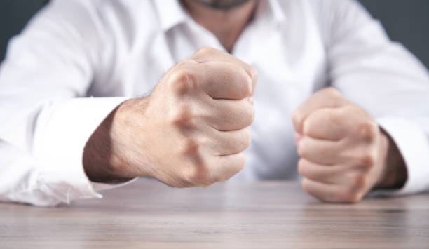 istock Angry businessman showing his fists. 1336262170