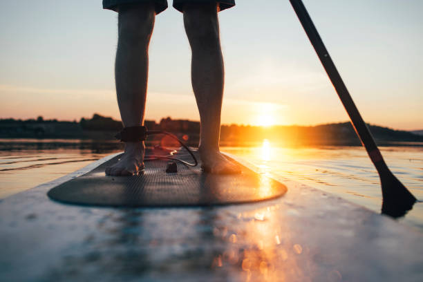 istock Close up of man paddling SUP board 1336264948