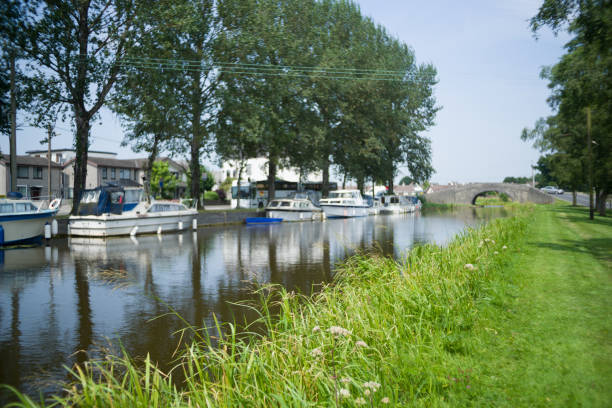 July 23 2021, the Grand Canal Harbour just off of the Grand Canal, Tullamore, Co. Offaly. A view from the grass section of the Harbour looking towards the boats docked and the bridge that connects the harbour to the Grand canal.