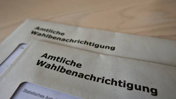 Letters with the official polling cards (in German on envelope: "amtliche Wahlbenachrichtigung", text below: statistical office) for the parliamentary elections in 2021. stock photo