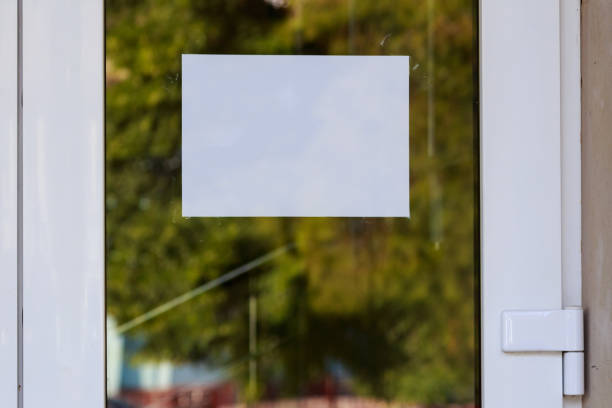 istock White blank A4 sheet attached to the front door. Background or copy space 1336272934
