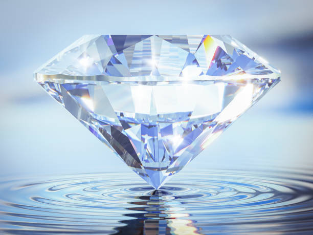 istock Luxury Shinning Diamond Balanced on Rippled Water Surface with Reflected Sky Background, Diamond Wallpaper, 1336275943