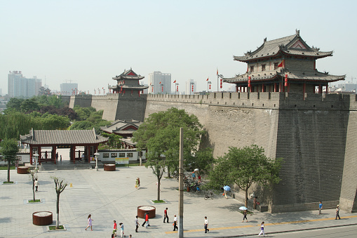 Visitors walk around one of the many lookout towers of the walled city of Xi'an.
