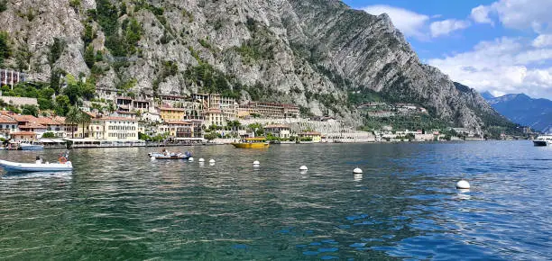 Limone Italy August 2021 the port of Limone in the background you can see the mountains in beautiful weather with blue sky