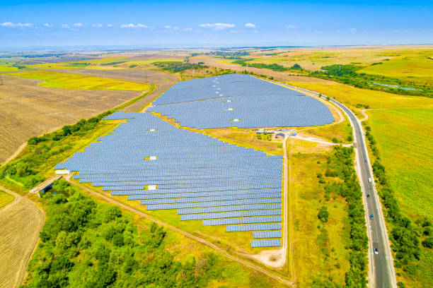 istock Fields of solar panels between agricultural fields in Bulgaria. Concept for green / clean energy, solar energy, sustainable energy power plant and sustainable resources. 1336280773