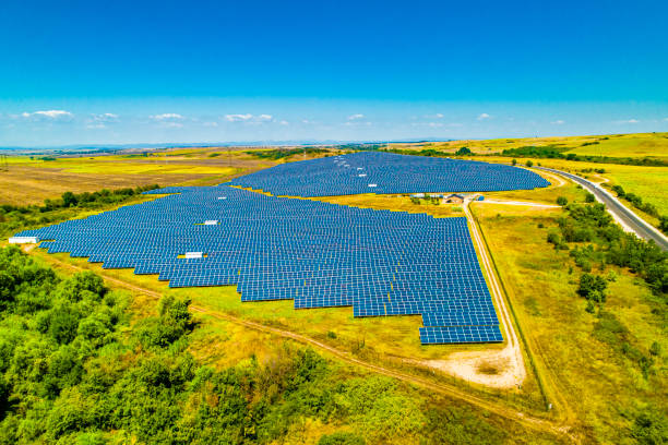 istock Fields of solar panels between agricultural fields in Bulgaria. Concept for green / clean energy, solar energy, sustainable energy power plant and sustainable resources. 1336280814