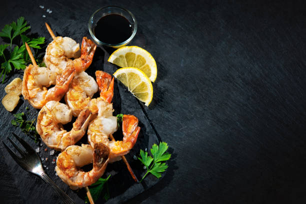 istock Grilled shrimp skewers served on black plate 1336282778