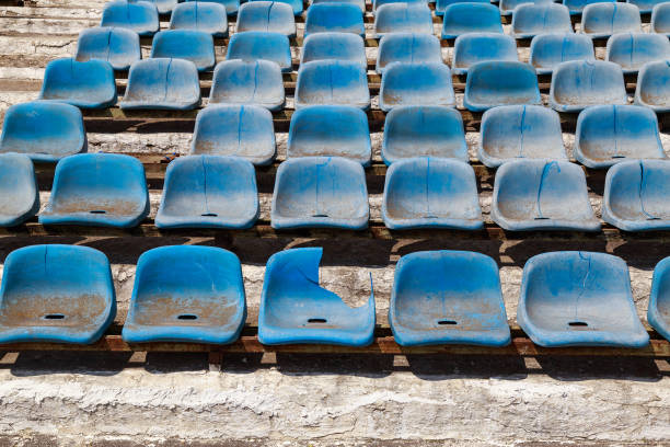 istock Destroyed stadium stands. Broken fan chairs. Selective focus 1336286729