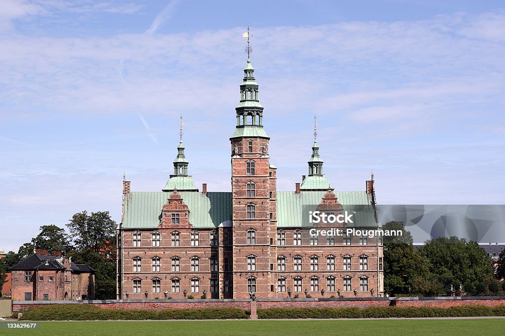 Rosenborg Castle, Denmark. Rosenborg Castle is a small castle situated at the centre of the Danish capital, Copenhagen. The castle was originally built as a country summerhouse in 1606 and is an example of Christian IV's many architectural projects. It was built in the Dutch Renaissance style, typical of Danish buildings during this period, and has been expanded several times, finally evolving into its present condition by the year 1624. Architects Bertel Lange and Hans van Steenwinckel are associated with the structural planning of the castle. Castle Stock Photo