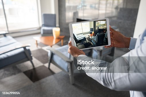 istock Real Estate Agent showing a property through an online video call 1336299054