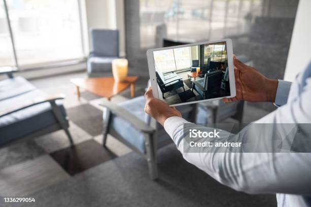 Real Estate Agent Showing A Property Through An Online Video Call Stock Photo - Download Image Now