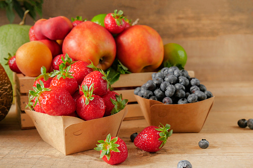 Fresh fruits. Healthy food. Mixed fruit, apricots and peaches. Blueberry. various fruits on an old wooden table. Organic healthy assorted fruits. place for text