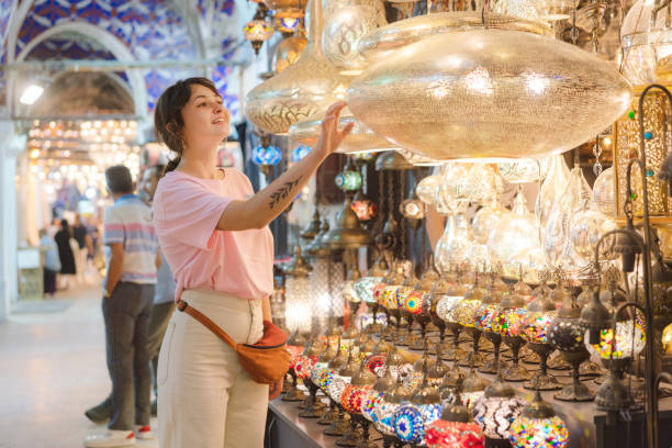 istock Woman choosing lamp on Grand Bazaar in Istanbul 1336299528