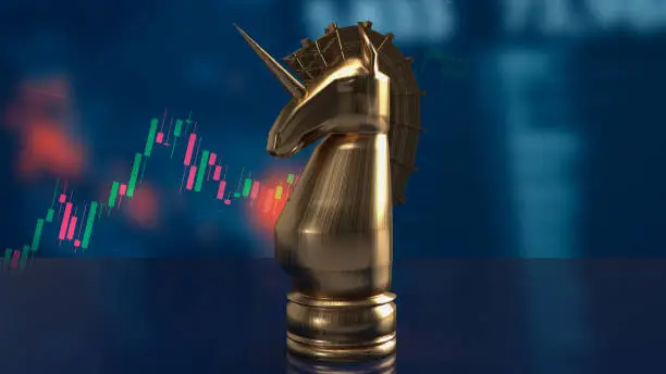 Photo of The gold  unicorn chess and business chart for start up concept 3d rendering