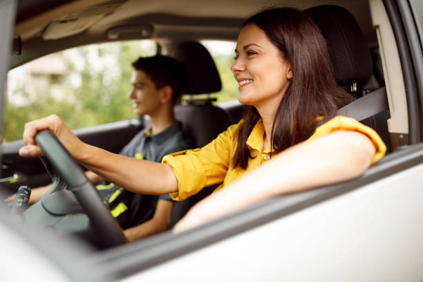 istock Mother driving her son to the school 1336300835
