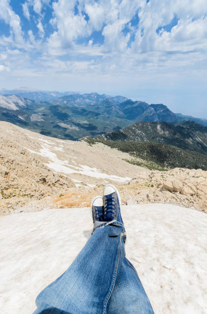 POV (Point of view) photo from ice peak view at shoes and mountains below stock photo