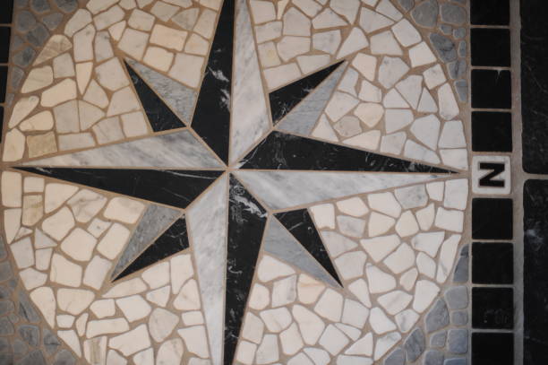 istock Black and white compass rose, sometimes called a wind rose or rose of the winds made with floor tiles on a floor mosaic 1336303501