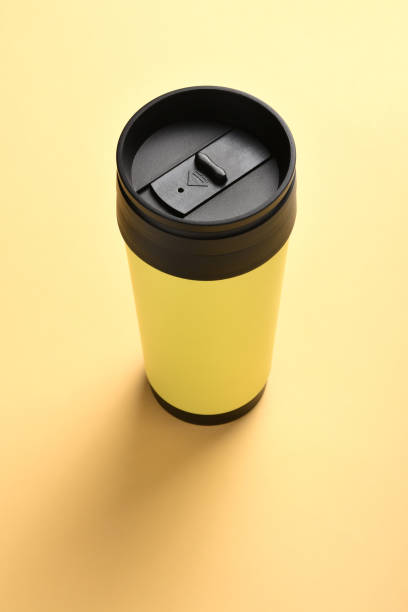 insulated drink container, coffee mug on the yellow background with copy space - 5599 imagens e fotografias de stock