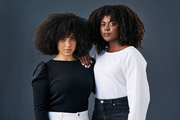 istock Two businesswomen together against a studio background 1336308402