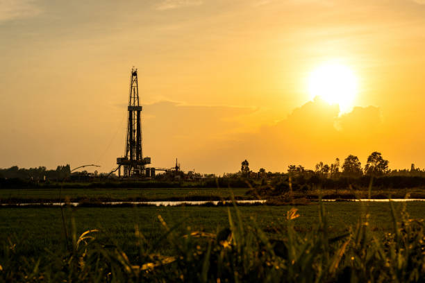 istock Silhouette black shadow of oil exploration drilling rig. 1336308461
