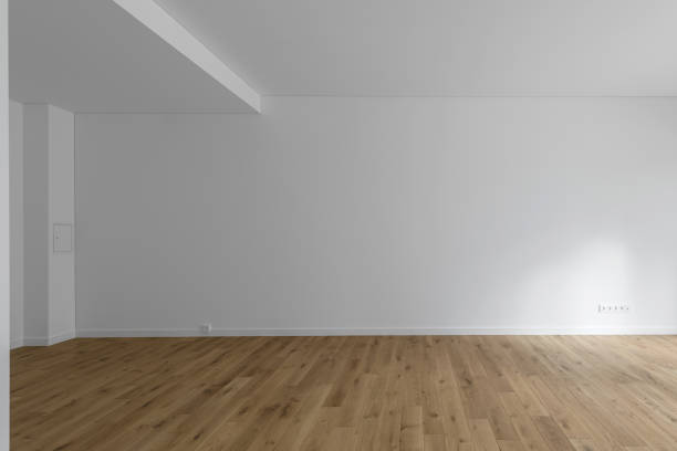 istock Empty minimalist modern room with white walls and oak wood floor 1336311154