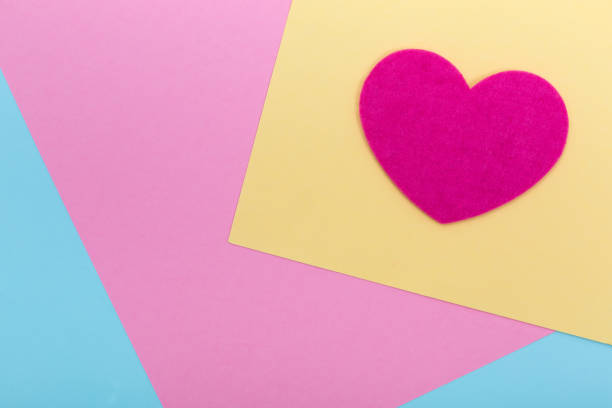 istock Heart shape on serenity colored paper texture 1336312027