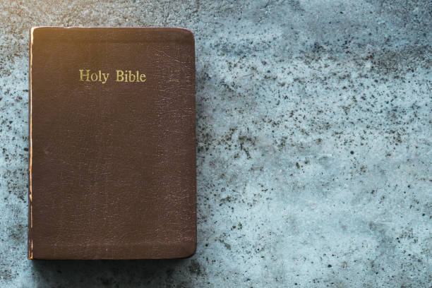 istock The Holy Bible is on a cement table.Religion concept 1336316701