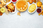 istock Thanksgiving greeting card background or festive dinner invitation template 1336317090