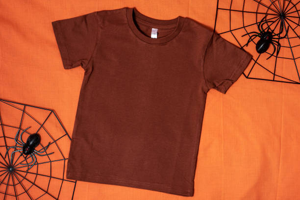 istock Brown t-shirt mockup on orange halloween background 1336318469