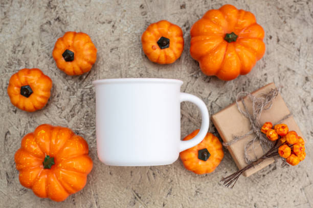 istock Mug mockup and pumpkins flat lay on wooden 1336318481