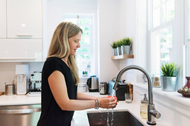istock Woman preparing lunch in home kitchen. 1336318500
