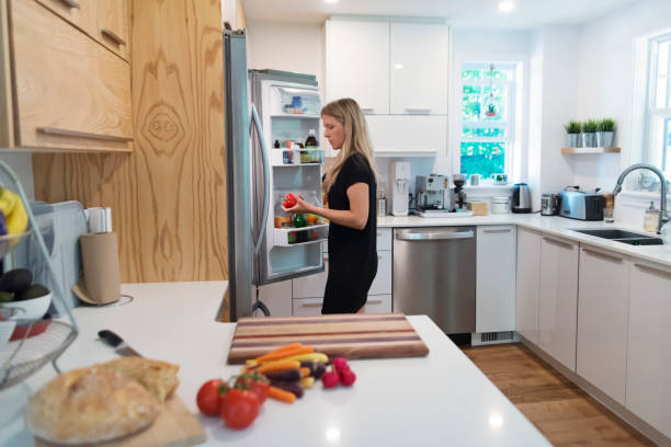 istock Woman preparing lunch in home kitchen. 1336318572