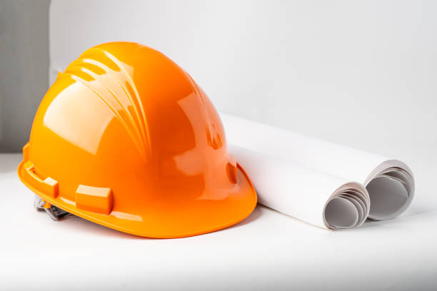 istock Orange construction helmet isolated on white background, engineer concept. 1336318602