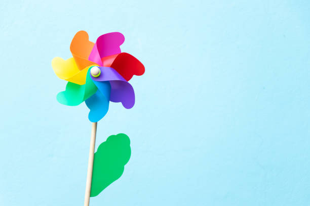 istock Colorful toy plastic turbine windmill on blue background 1336321705