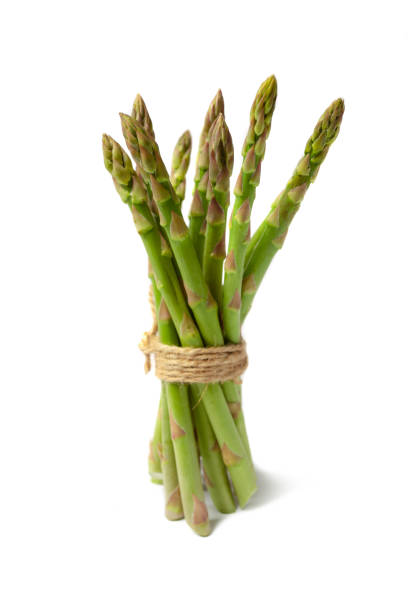 istock Green asparagus sticks isolated on white background 1336321793