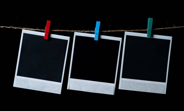istock Blank square photo frames hanging on a clothesline 1336323178