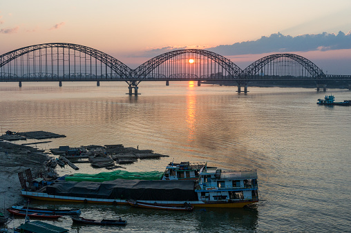 Myanmar. Sagaing. Region of Mandalay. Sunset on Yadanabon Bridge crossing the Irrawaddy river