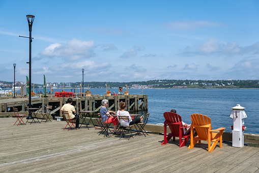 Halifax, Nova Scotia, Canada - 10 August 2021: People enjoy sunny day at Halifax Harbourfront, Canada