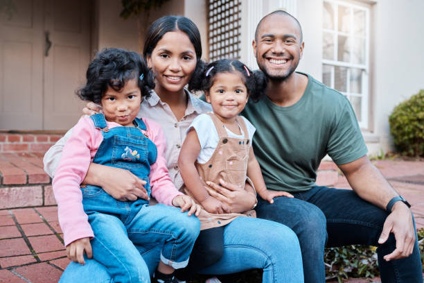 istock Shot of a couple spending time outside with their two daughters 1336335059