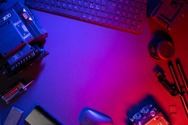 istock Flat lay of computer parts and video camera on illuminated table 1336336550