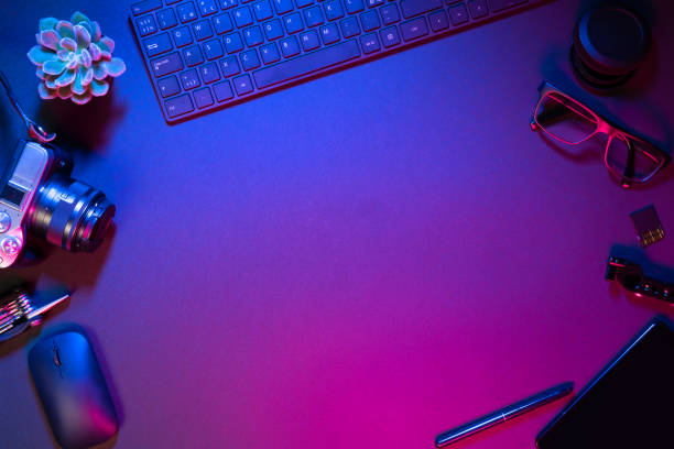 istock Flat lay of computer parts with camera on illuminated table 1336336560