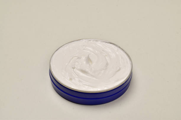 istock Cosmetic cream in container on white background 1336341641