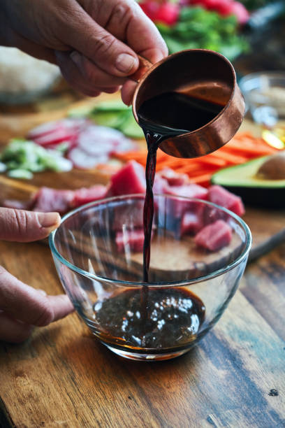 istock Preparing Ahi Tuna with Cucumber, Radish, Carrots and Avocado 1336342000