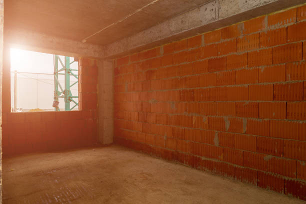 istock room in a building under construction. Multi-storey residential buildings. toned background 1336344150