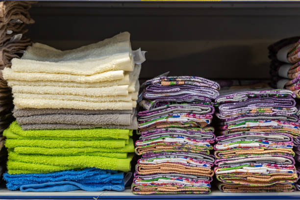 istock Stacks of towels on a store shelf. Showcase with textiles for personal hygiene. 1336344247