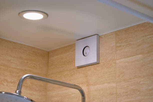 electric extractor hood in the bathroom. electric exhaust fan. ventilation of the air in the bathroom. maintaining the microclimate in the bathroom - aeration imagens e fotografias de stock